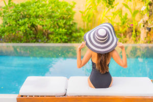 portrait-beautiful-young-asian-woman-relaxes-swimming-pool